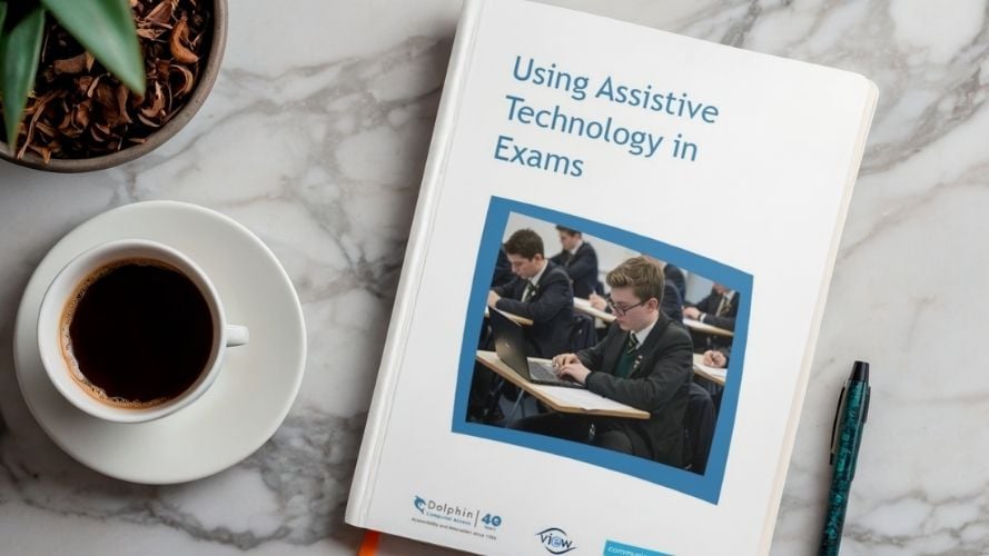 Copy of the Using AT in Exams print out on a coffee table